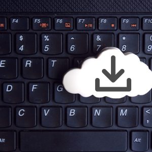 White cloud with download icon on keyboard